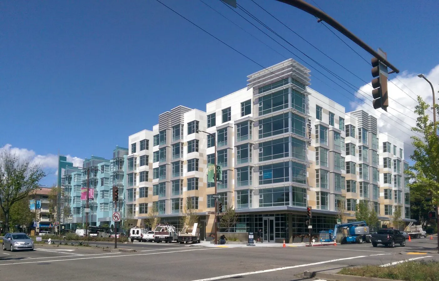 A five-over-one apartment building — the same luxury box going up in every city